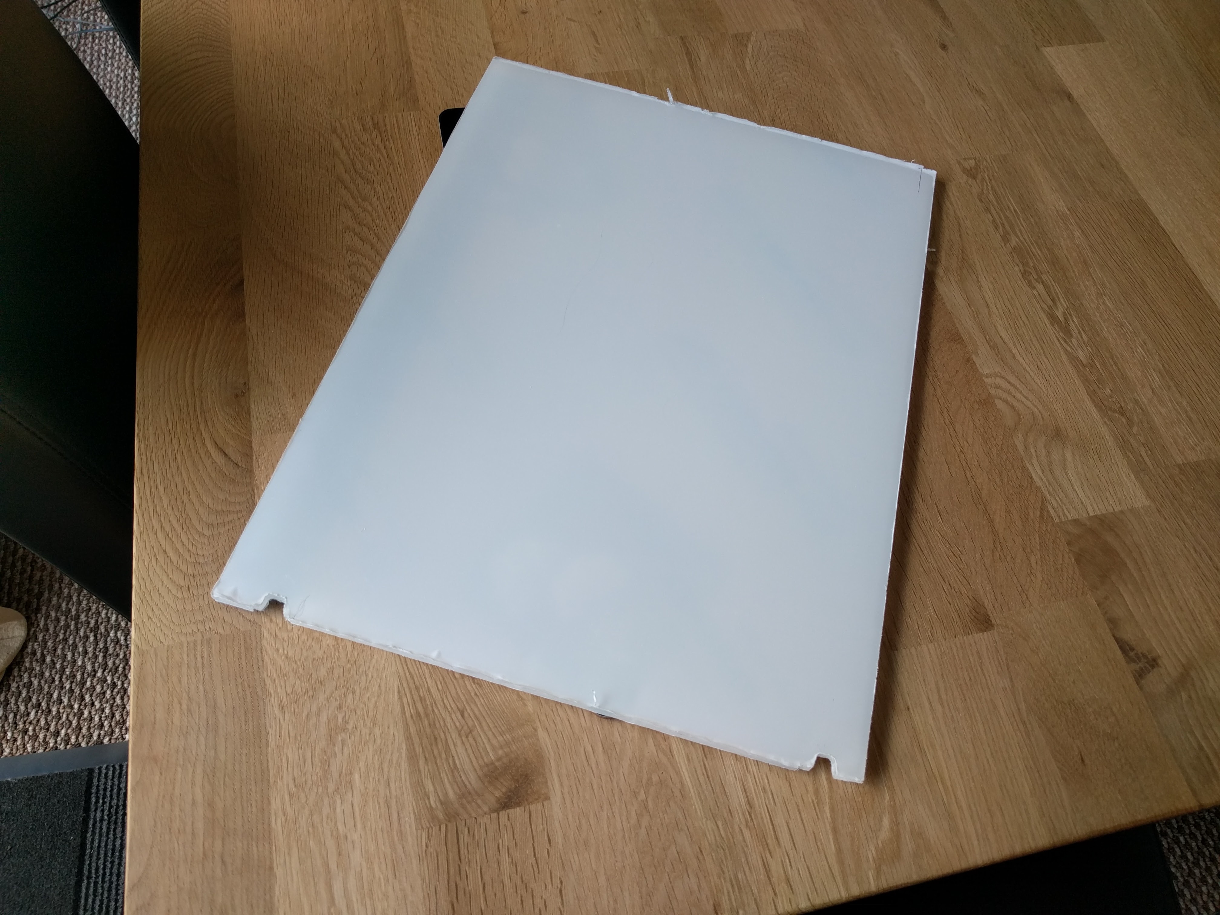 Back board for the front compartment of the case, With the first notches cut out.