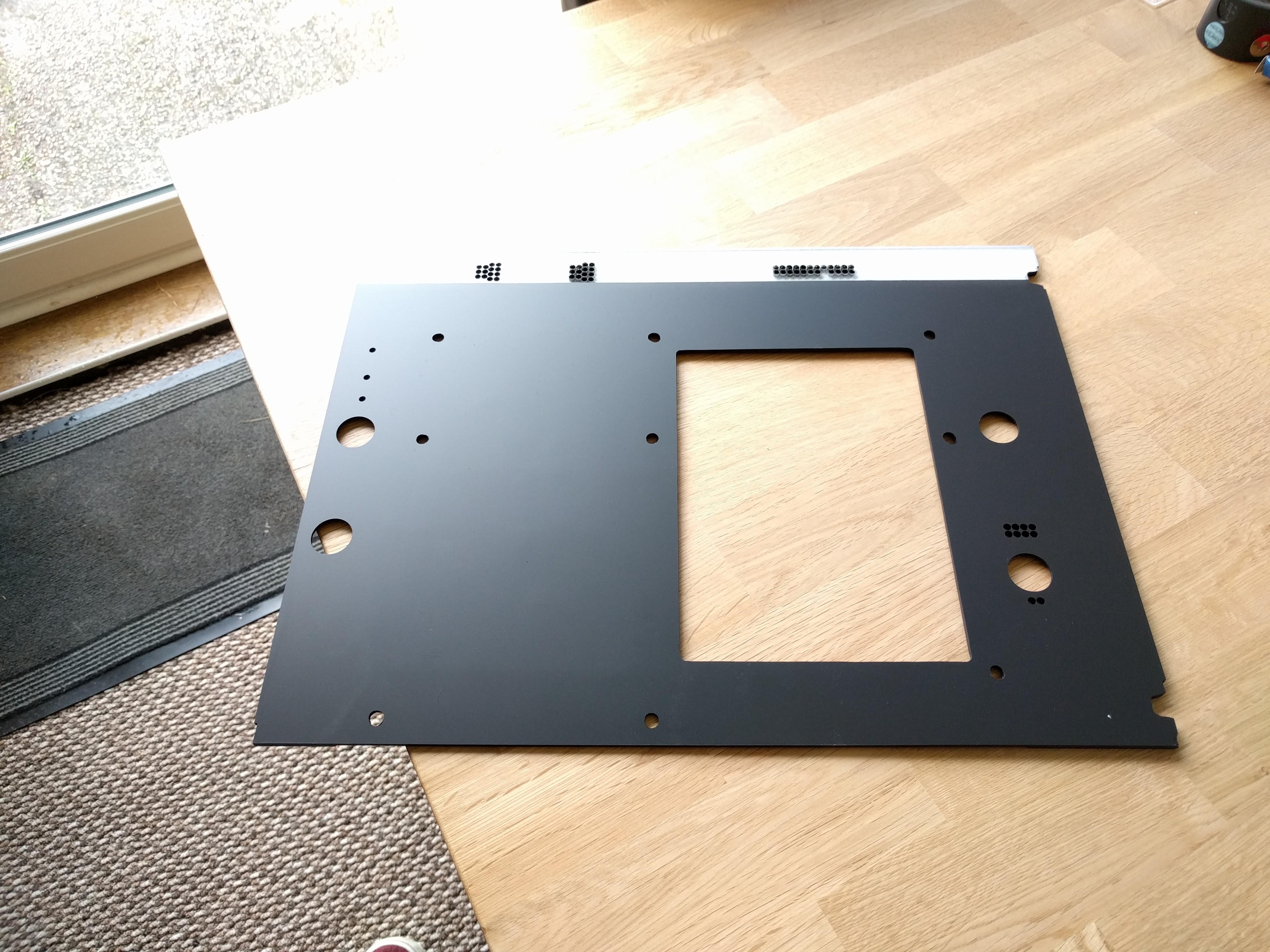 Leading edge of the backboard has been left transparent revealing the white undercoat on the opposite side.