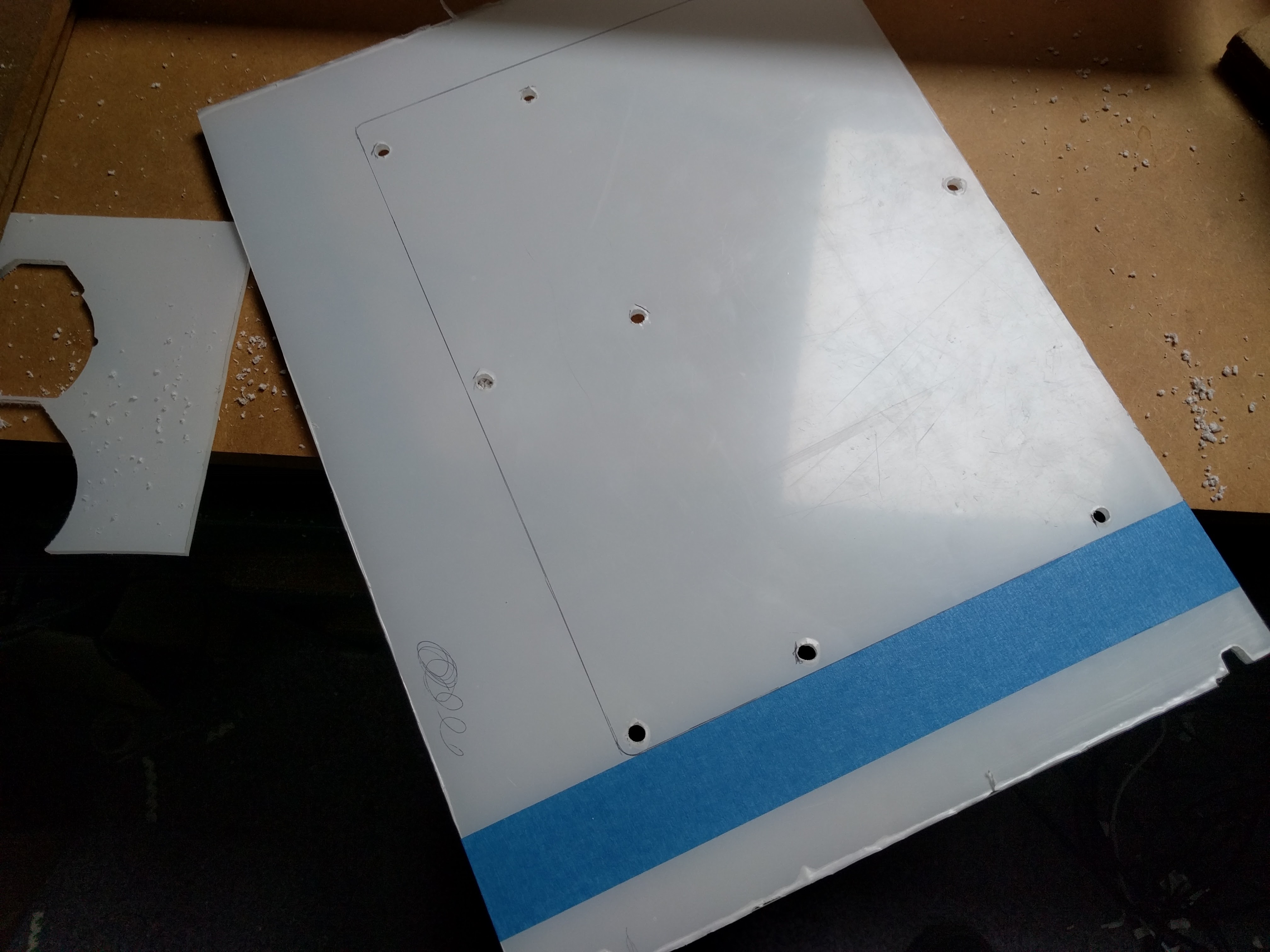 Drilling of standoff locations and marking the perimiter of the motherboard.