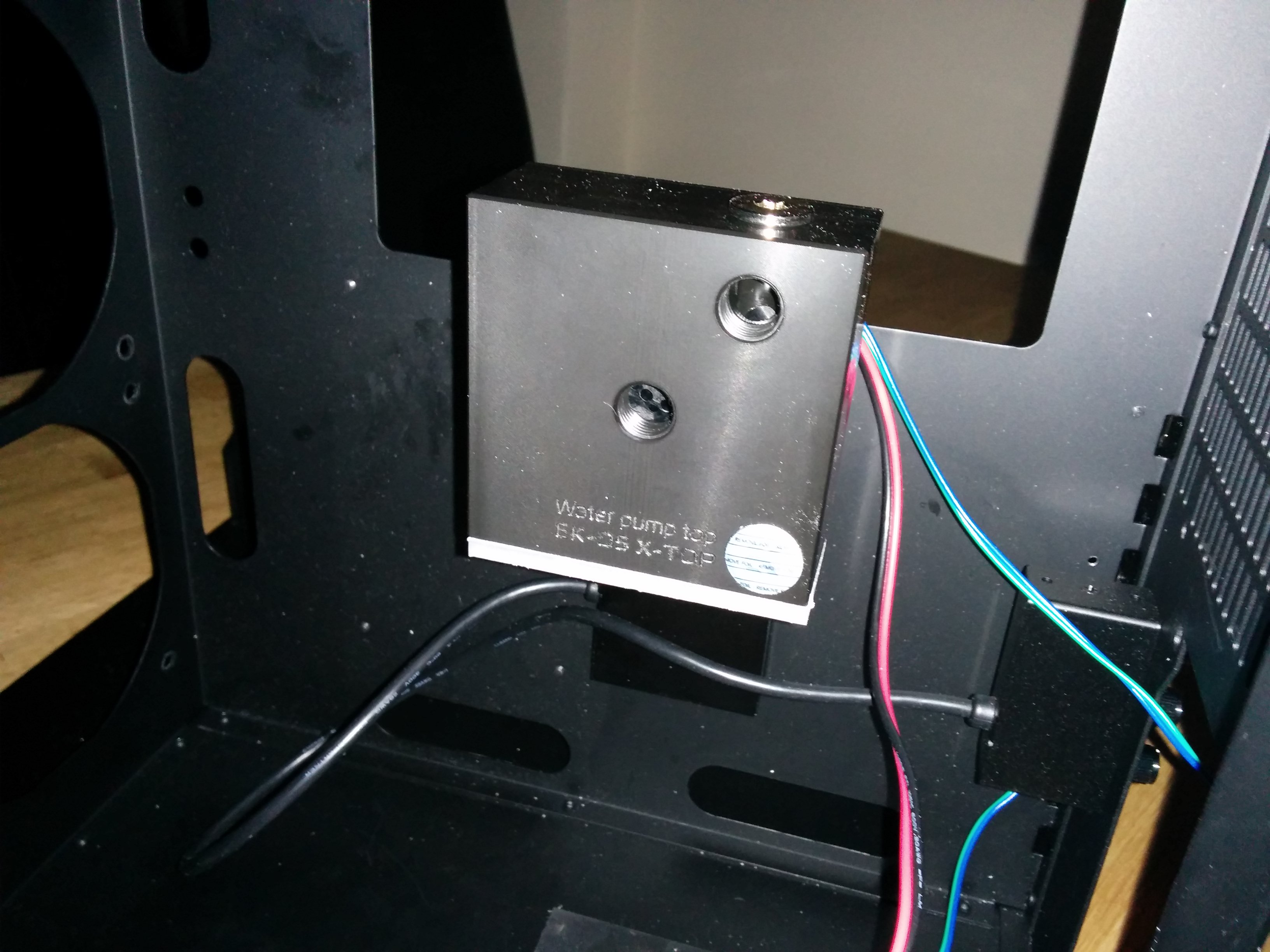 Water pump mounted to braket.